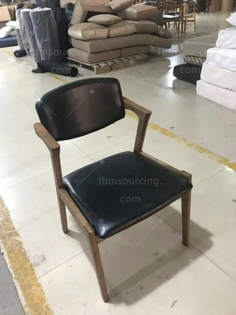 Timber-frame dining chair with dark upholstered seat and back