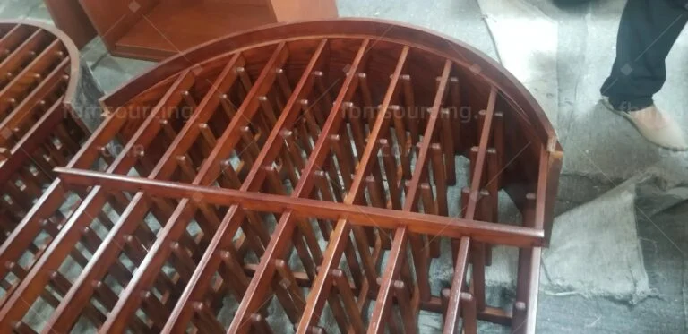 Curved timber rack frame checked at the inspection