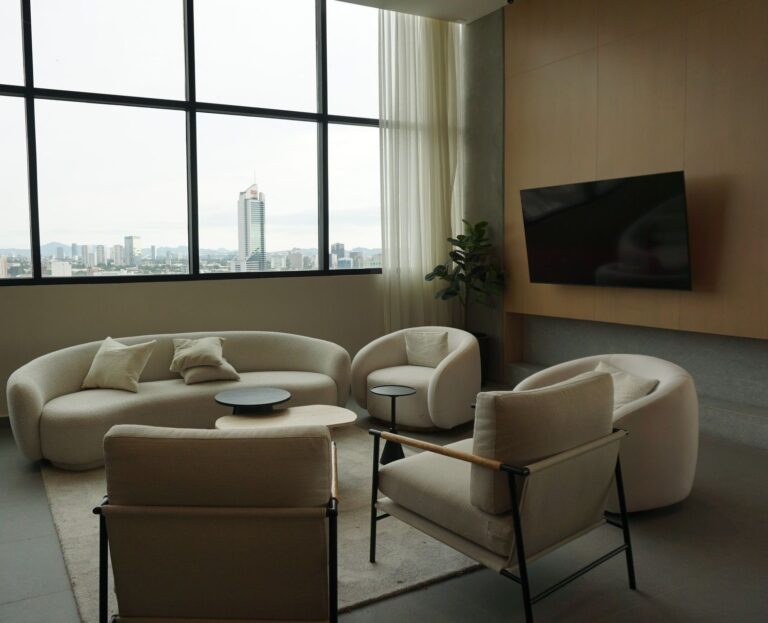 Bright lounge with upholstered armchairs and natural light