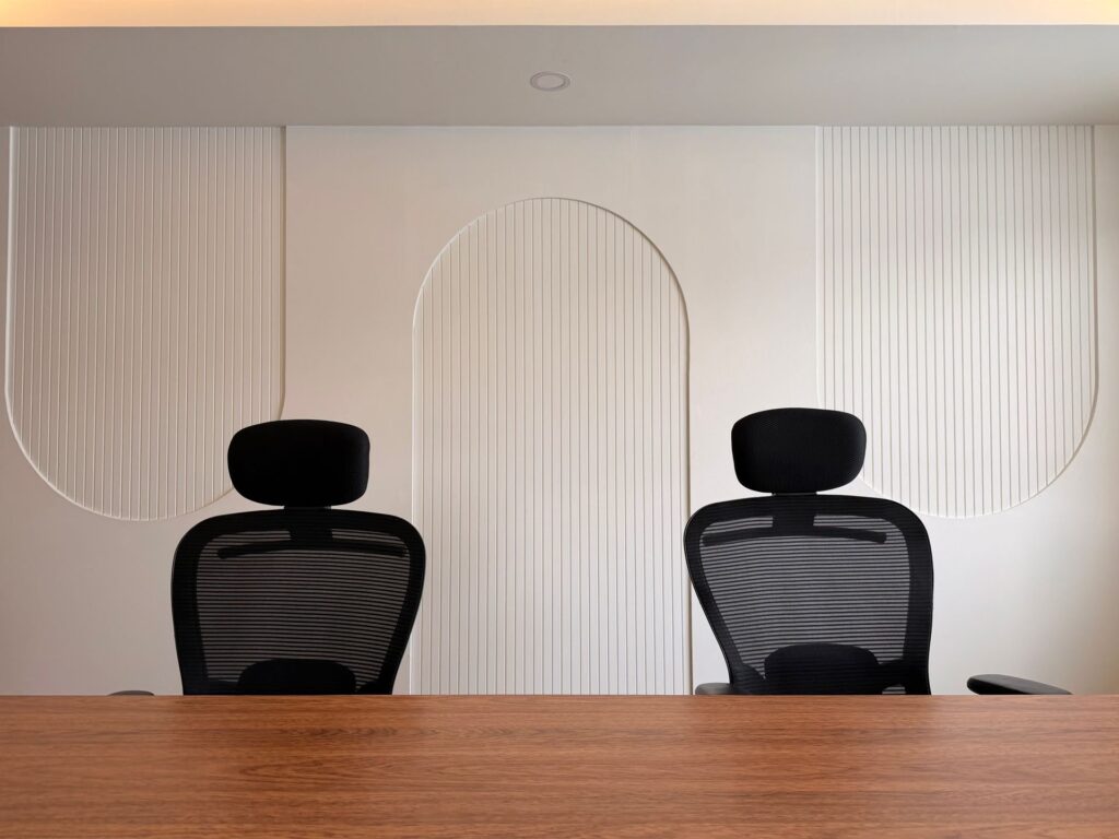 Contemporary office with meeting table and chairs