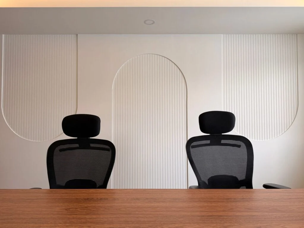 Contemporary office with meeting table and chairs