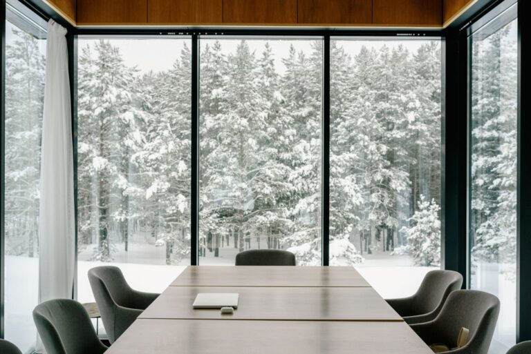 Contemporary office with meeting table and chairs