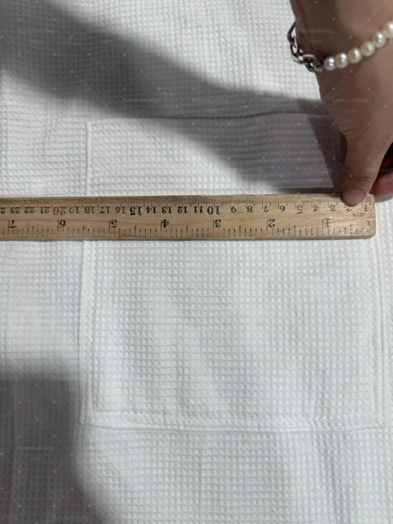 Hotel linen measured with a rule at the inspection