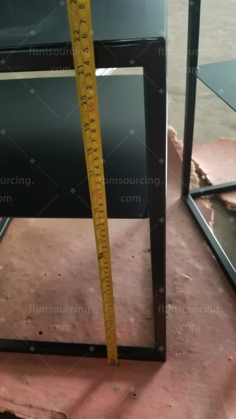 Black side table height measured at the inspection