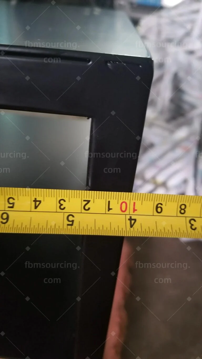 Corner of a black steel table frame measured at the inspection