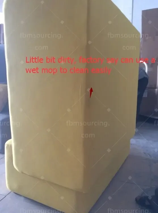 Side panel of a yellow high-back seat with a surface mark flagged in the inspection photo