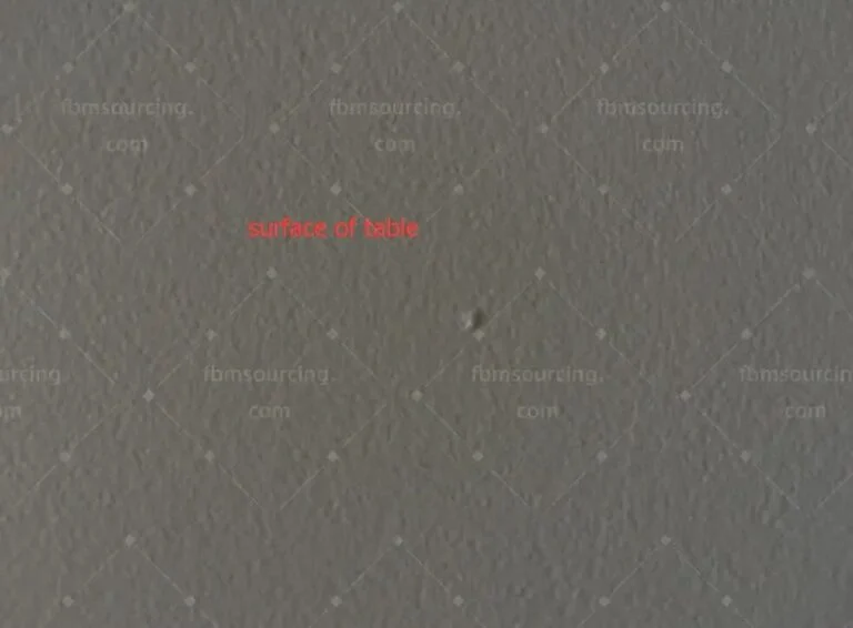 Close-up of a round tabletop surface checked at the inspection