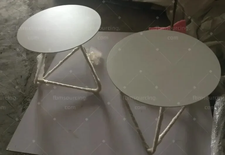 Two round tables with protective wrapping on the legs, checked at the inspection