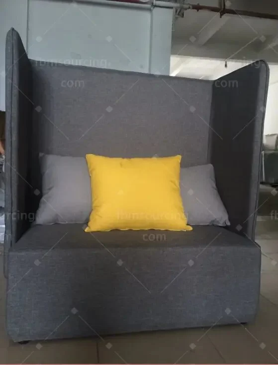 Grey upholstered high-back lounge seat, front view at the inspection