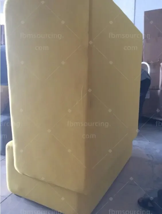 Side panel of a yellow high-back seat checked at the inspection