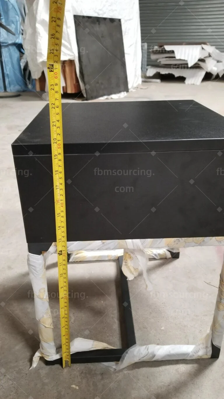 Dark bedside cabinet on a steel frame, height measured