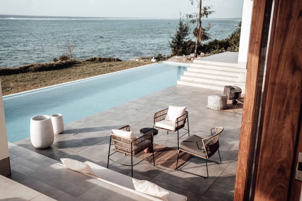 Pool terrace with slim-frame outdoor lounge chairs