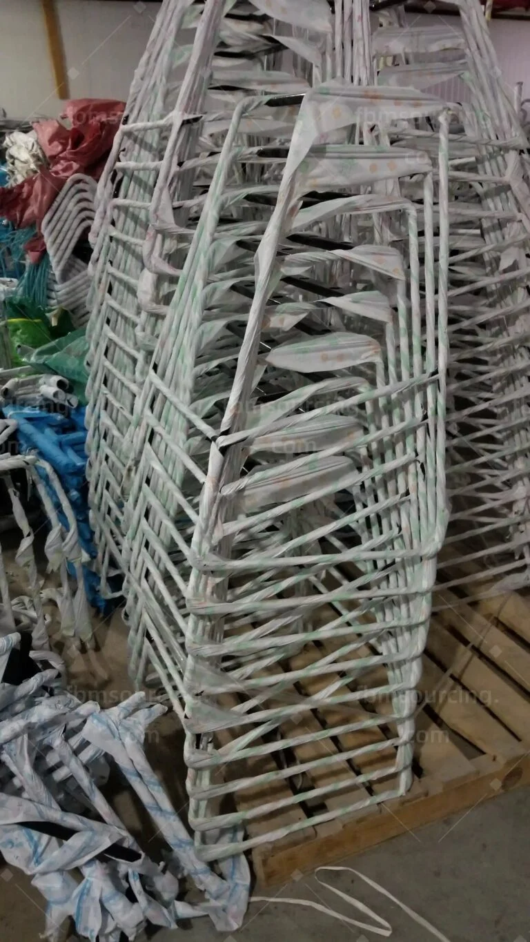 Chair frames wrapped and stacked for export packing