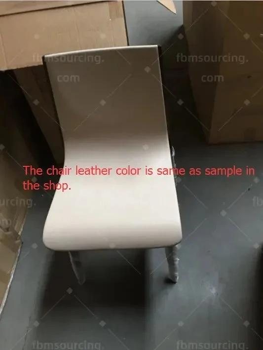Cream leather dining chair checked against the showroom sample